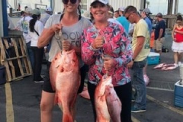 a group of people standing in front of a crowd