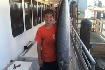 a man standing in a kitchen