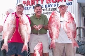 a man holding a fish