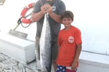 a person holding a fish