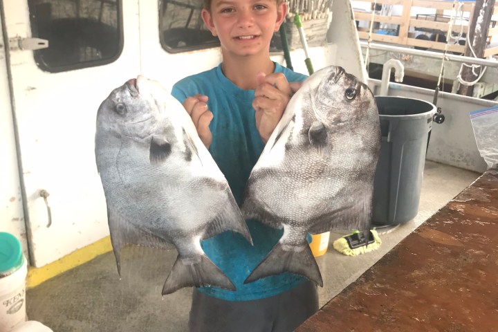 a person standing next to a bus