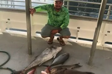 a little boy that is sitting on the ground
