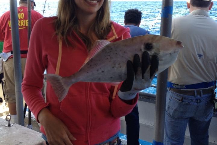 a person holding a fish