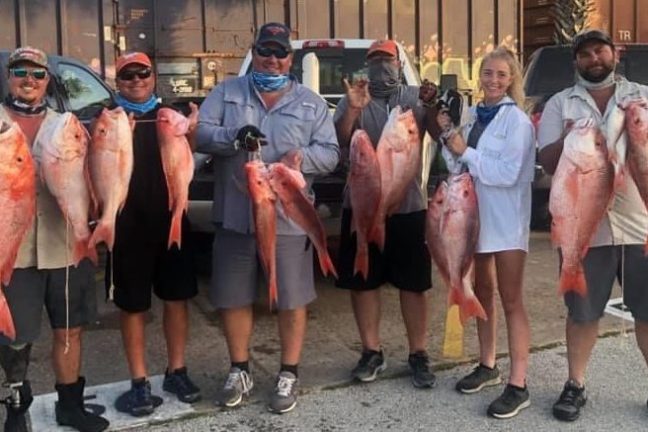 a group of people posing for the camera